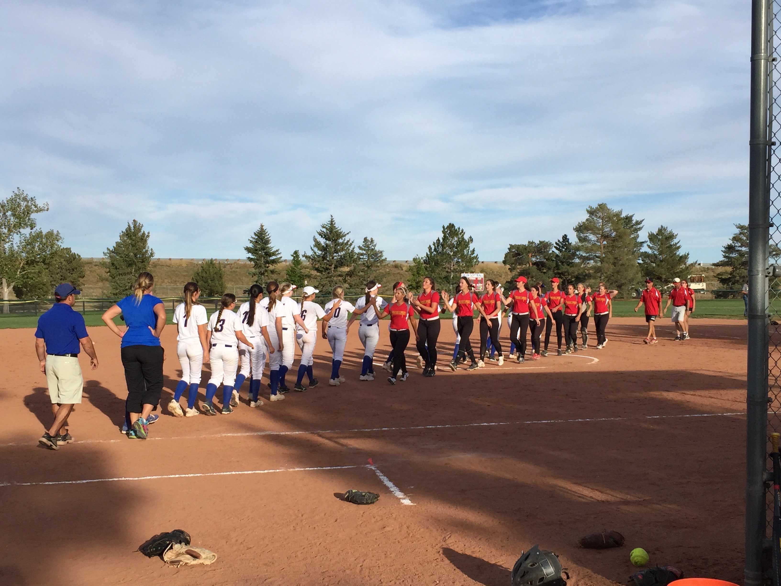 The 2015 Cherry Creek Softball team shakes hands after their 9-7 win over Castle View High School.