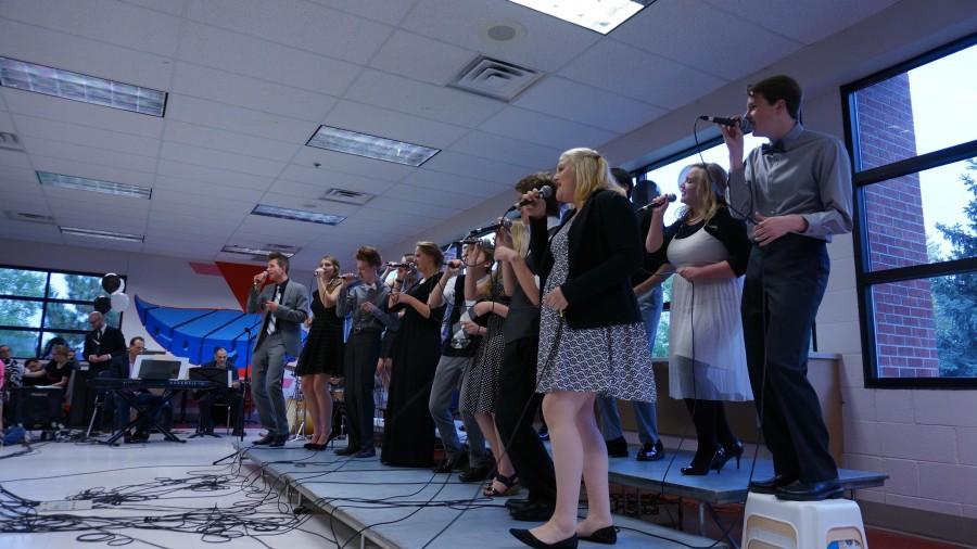 The jazz choir sings inside IC cafe during the Jazz on the Green event