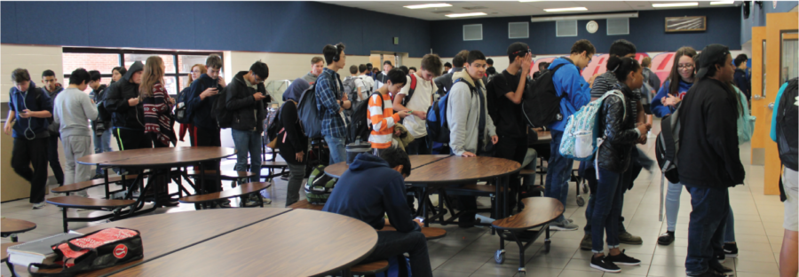 With the closing of the I.C. Café, students brave the long lines in West cafeteria during fourth period, the only source of on-campus food.