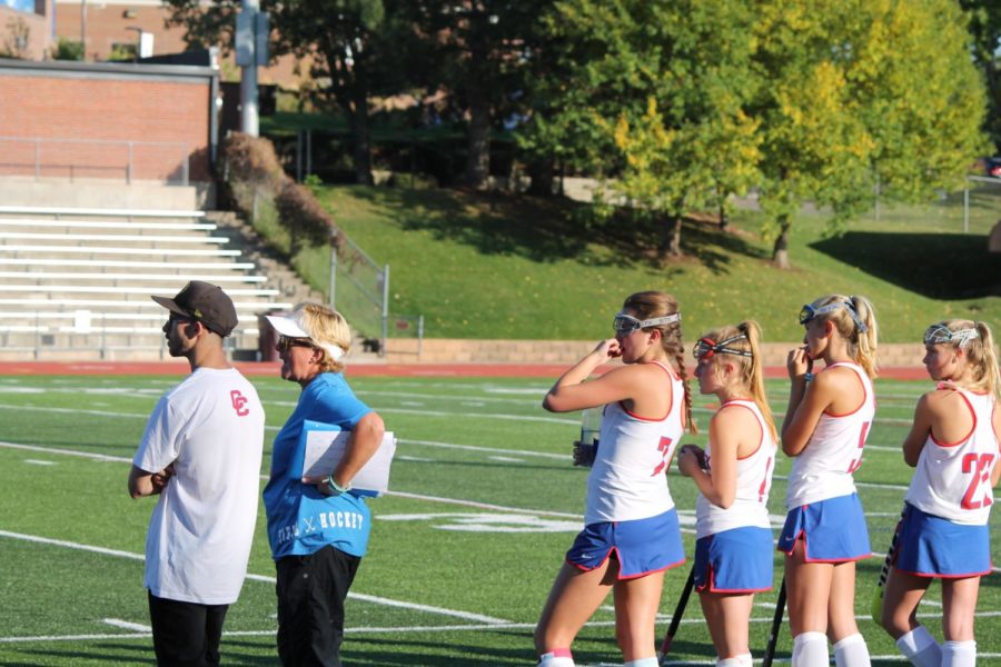 New coach Jenny Hilyard leads her players in their win against Denver East, the second game of their three game win streak.