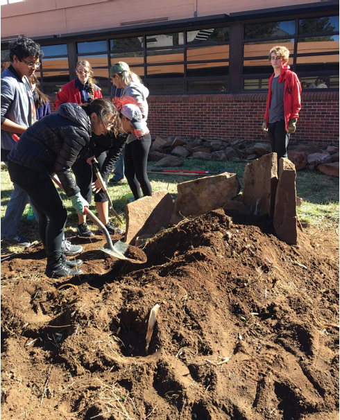 Students plant kale in the East Courtyard.