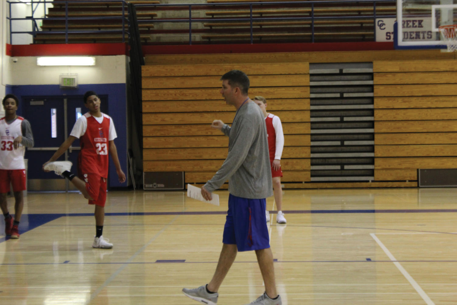 COACH ‘EM UP: Coach Dertinger, in his second season as head coach, led varsity basketball to the playoffs.