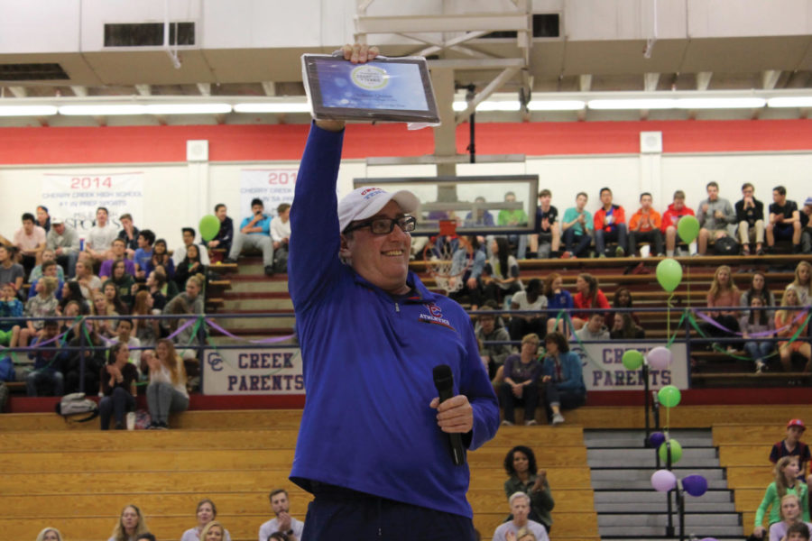 ACE: Coach Quinn received his award during the pep assembly on March 9.