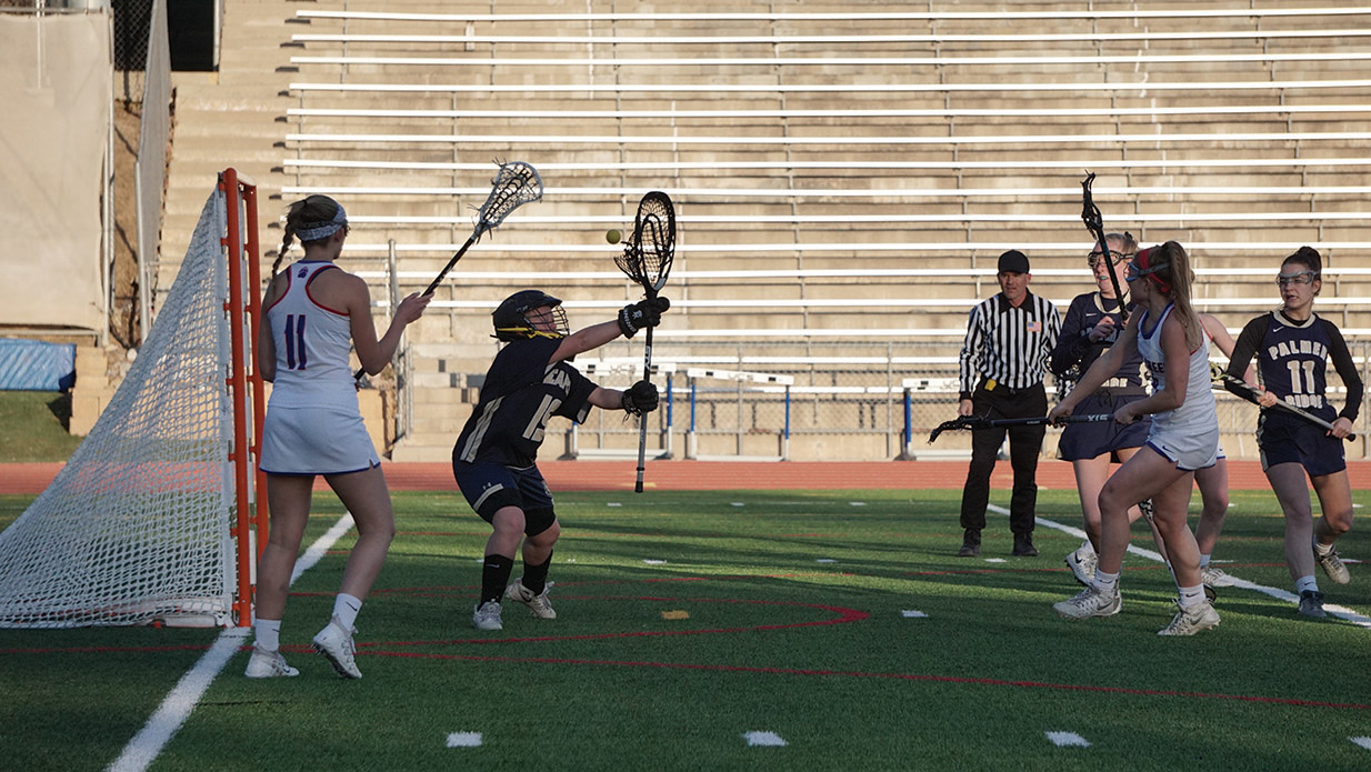 GOALS AND WINS: Senior Pearl Schwartz fires the ball for the goal on March 13 in an 18-3 win against Palmer Ridge.