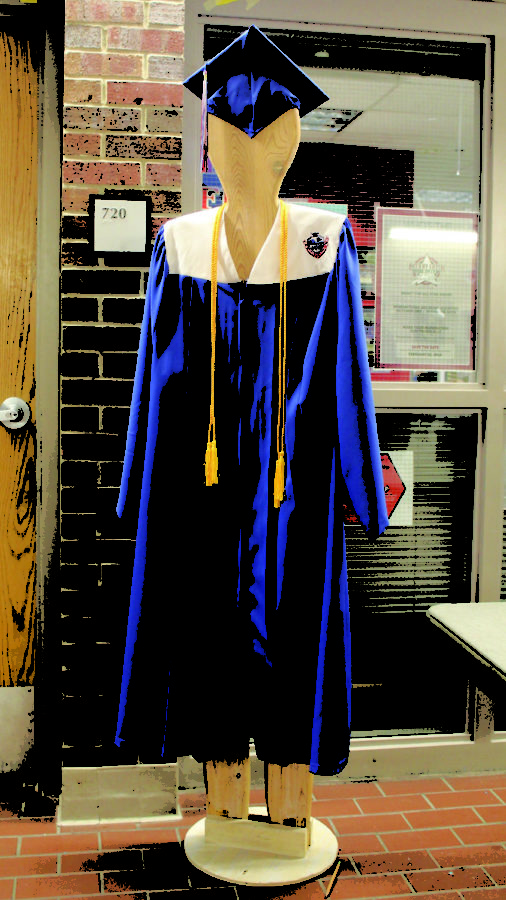 The new custom graduation gown is on display outside of the Activities office.