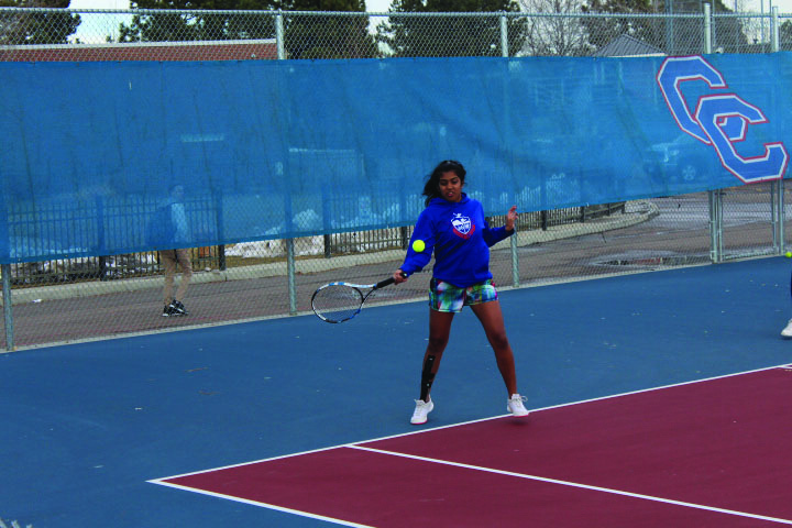 GROUND STROKES: Junior Maya Devarajan works on her forehand during practice on March 7. The players first challenge will be against George Washington High School on April 3.