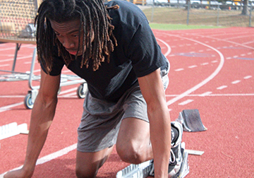 READY, SET...: Sophomore Asend Ashby getting ready to race during practice on Mar. 12. Their next  meet is on Saturday Mar. 30 at Fort Collins High School. 