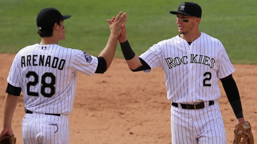 Third+baseman+Nolan+Arenado+%28left%29+and+shortstop+Troy+Tulowitzki+congratulate+each+other+during+a+game.+The+Rockies+had+what+was+considered+by+some+to+be+the+best+infield+in+the+MLB+in+the+early+2010s.+Tulowitzki+was+traded+against+his+will+in+2015%2C+which+has+been+blamed+on+General+Manager+Jeff+Bridich.+This+angered+Tulowitzki%2C+and+it+angered+Arenado%2C+who+considered+Tulowitzki+a+friend+and+mentor.+Arenado%E2%80%99s+relationship+with+the+Rockies+was+never+the+same.+When+he+re-signed+with+them+in+2018%2C+he+chose+to+have+a+no-trade+clause+so+the+same+wouldn%E2%80%99t+happen+to+him.+After+several+conflicts+with+Bridich%2C+Arenado+asked+to+be+traded.+He+was+signed+to+the+St.+Louis+Cardinals+this+weekend.