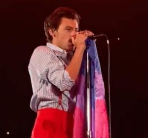 Harry Styles holds a bisexual pride flag while performing his song Treat People With Kindness in Denver Sep. 7. Although many fans came to love him as a member of One Direction, the well-known boy band, Styles has also had a successful solo career with hits such as Sign of the Times, Adore You, Watermelon Sugar, and Golden.