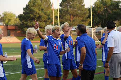 Senior midfielder Cyrus Gulati gets spirited at a game this season, making gestures at a coach. Gulati has plans to move to Germany after high school and play professional soccer in Germany.