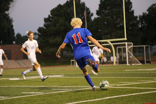 Senior Macklin Riley sends a pass cross-field during a game this season. Creek ended the regular season with a 9-6 record.