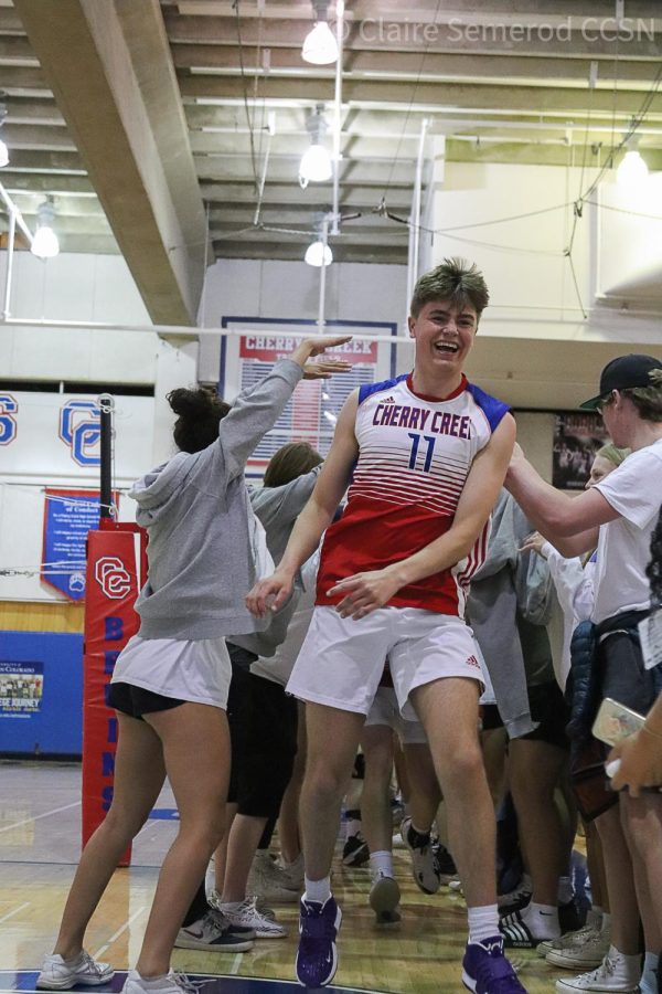 Captain senior Miles Manthe exits the human tunnel after Creeks win over Valor. Photo taken by Claire Semerod