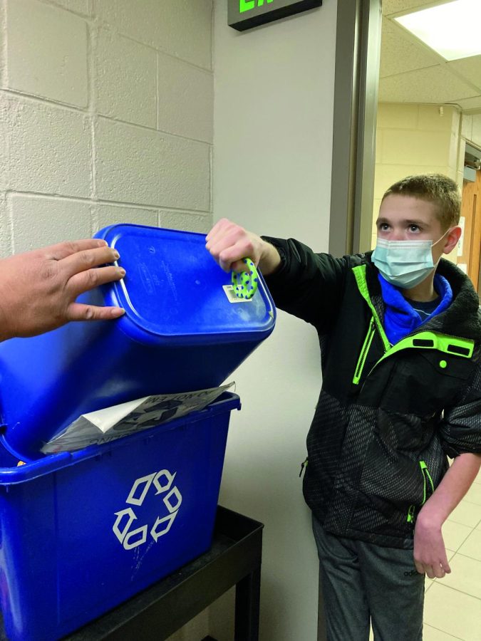 KEEPING+CREEK+GREEN%3A+Sophomore+Thorin+Foster+helps+dump+out+recycling+bins+in+the+East+building.+Creek%E2%80%99s+current+recycling+program+is+run+by+ILC+students%2C+who+help+empty+out+bins+every+week.