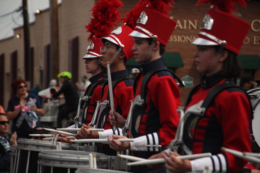 Part of the Creek drumline performs with the marching band during the Western Welcome Week Parade. In addition to the marching bands general win, the drumline also placed first in their own category Aug. 20.