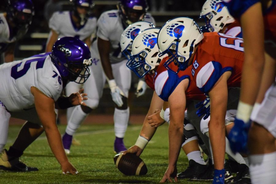 The two teams line up for a Creek offensive drive. Creek's offensive dominated the game, scoring six touchdowns.