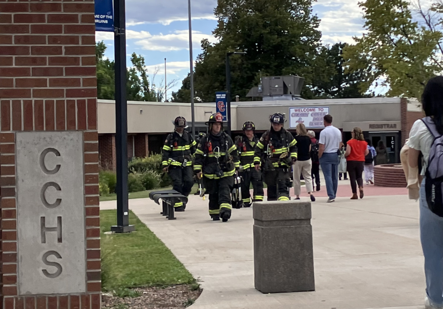Firefighters from the South Metro Fire Department return to their engine after successfully resolving the emergency on Tuesday.