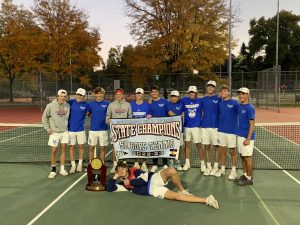 Varsity Boys Tennis team poses after their victory over Valor Christian at the 5A State Championship. 