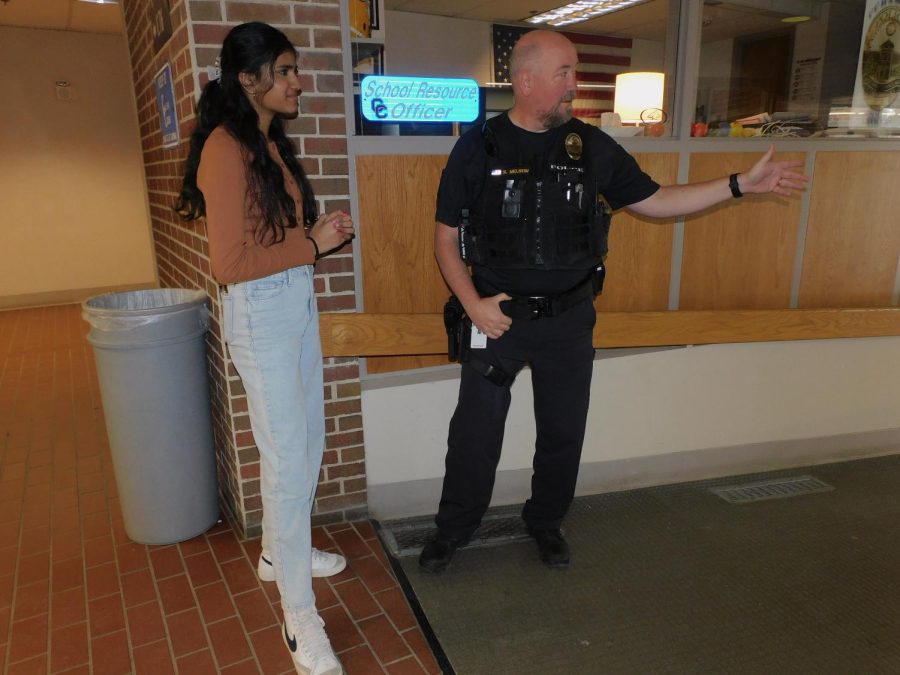 SRO Superviser Steve Nelson talks with sophomore Deeksha Amarala. “Were not here to try to remind you that bad things happen; were here to be a resource,” Nelson said. “But we also try to walk around with a smile on our face.”