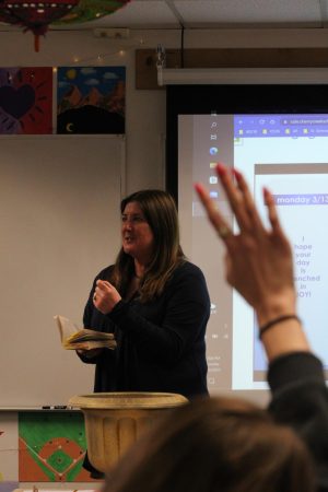 English teacher Christin Jacob lectures her AP Language and Composition class. After teaching at Creek for 18 years, Gilbert will next year take on the role of English Coordinator.