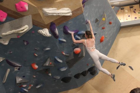 Junior Michelle Markevych hangs off a handhold on boulder 18. “I saw everyone finish the comp strong physically, mentally, and emotionally,” Markevych. “Even if the scores werent exactly what they wanted.”