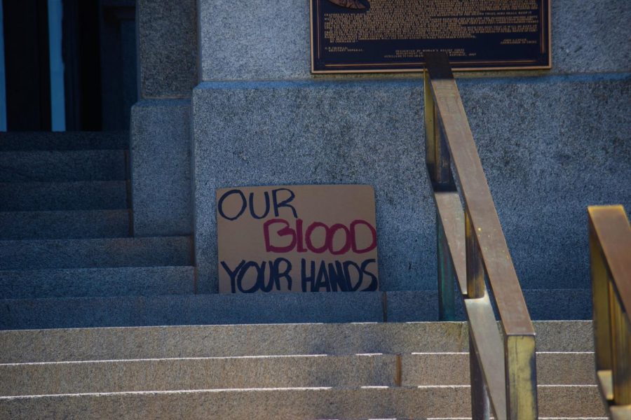East SDA leaders left a sign reading “Our blood, your hands” on the steps to the Capitol after the march ended.