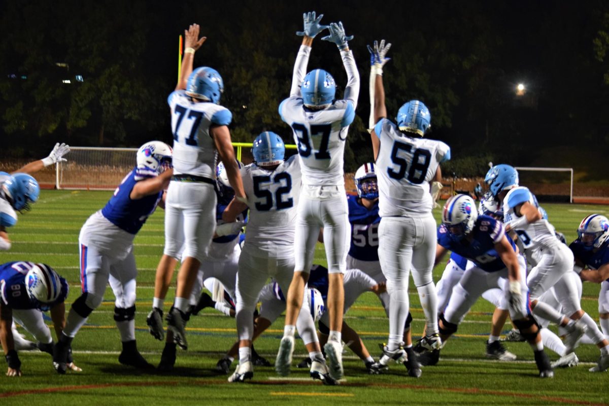 Ralston Valley players attempt to block an extra point by Creek senior kicker Thomas Goeglein (#49), who increased the score to 28-9 after a touchdown by sophomore wide receiver Max Lovett (#6) at minute 5:12 in the third quarter. Creek Varsity Football beat Ralston Valley 35-9 in their season opener on Friday night.