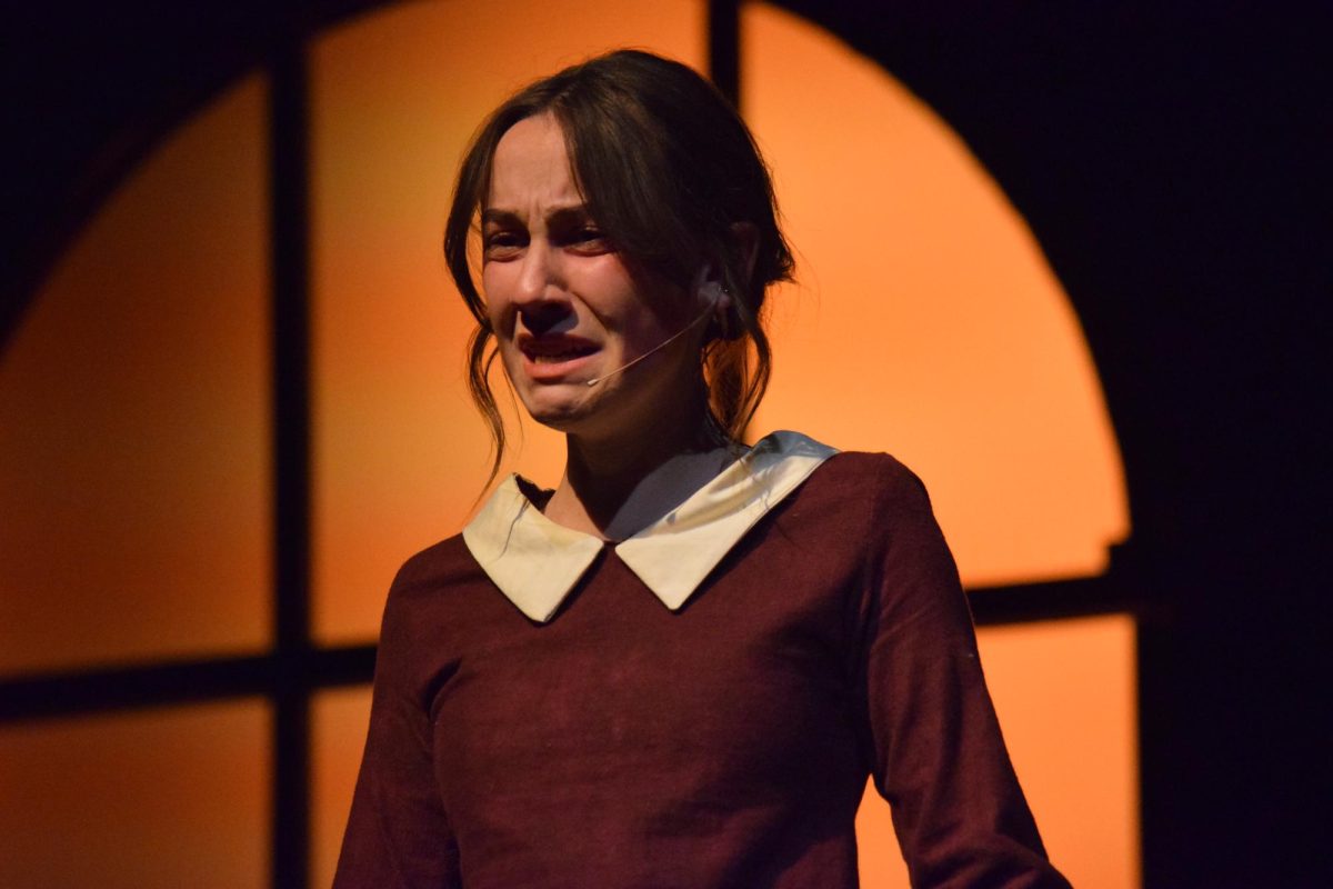 Creek theater held their fall play, “Radium Girls,” from Thursday, Nov. 4 to Saturday, Nov. 5. Senior Molly Grantz, who plays Grace Fryer, the lead, cries as she is offered a hush deal by the watch-making company after filing a lawsuit against them. Fryer, among many other women who painted glow-in-the-dark watch faces with radium paint, fell ill with radium poisoning and decided to speak out against the wrongful actions and denial of responsibility within the company she worked for.