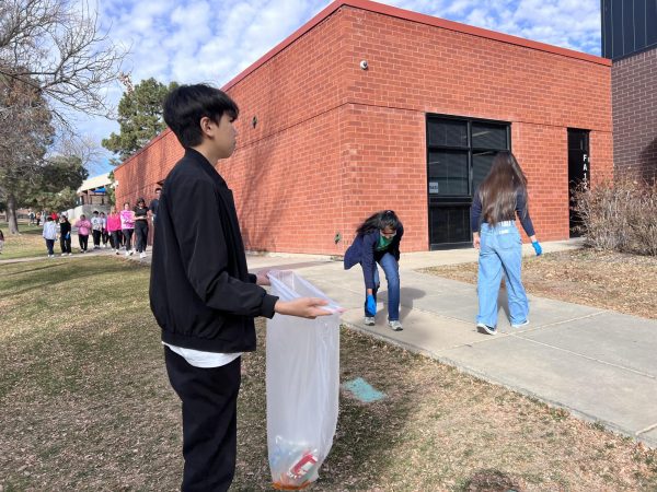 Advisory students collect trash behind Fine Arts. Hundreds of students have participated in organized campus cleanups. “Kids need to do their part, adults need to do their part,” campus administrator Brynn Thomas said.