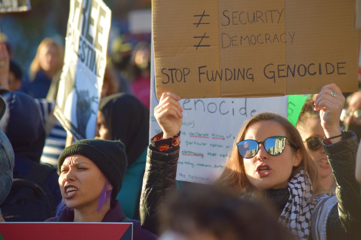 A protestor holds up a sign that asks officials to “Stop funding genocide.” Speeches at the protests often centered around how the United States continues to fund Israel throughout the Israel-Hamas war. “This [protest] is not what we’re just seeing in Denver,” Skye, a DSA student, said. “We’re seeing this across the world, as people are seeing through Israel’s lies, through America’s lies, and recognizing that what is going on is a genocide, is ethnic cleansing.”