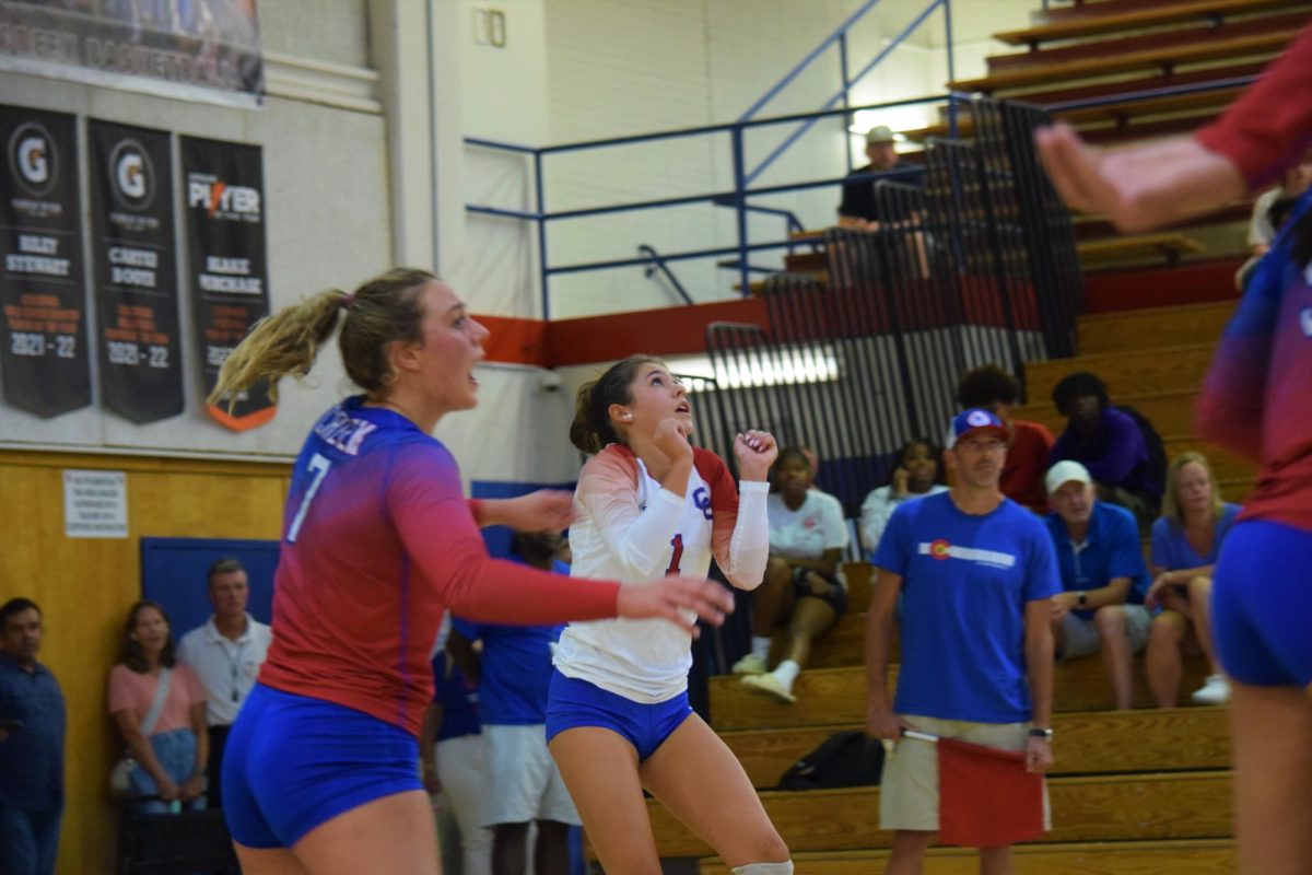 Senior outside hitter Ava Ross (#7) competes during a 2023-24 season volleyball game. This year, Ross is one of the captains for the team, balancing both athletic play and team building responsibilities. 