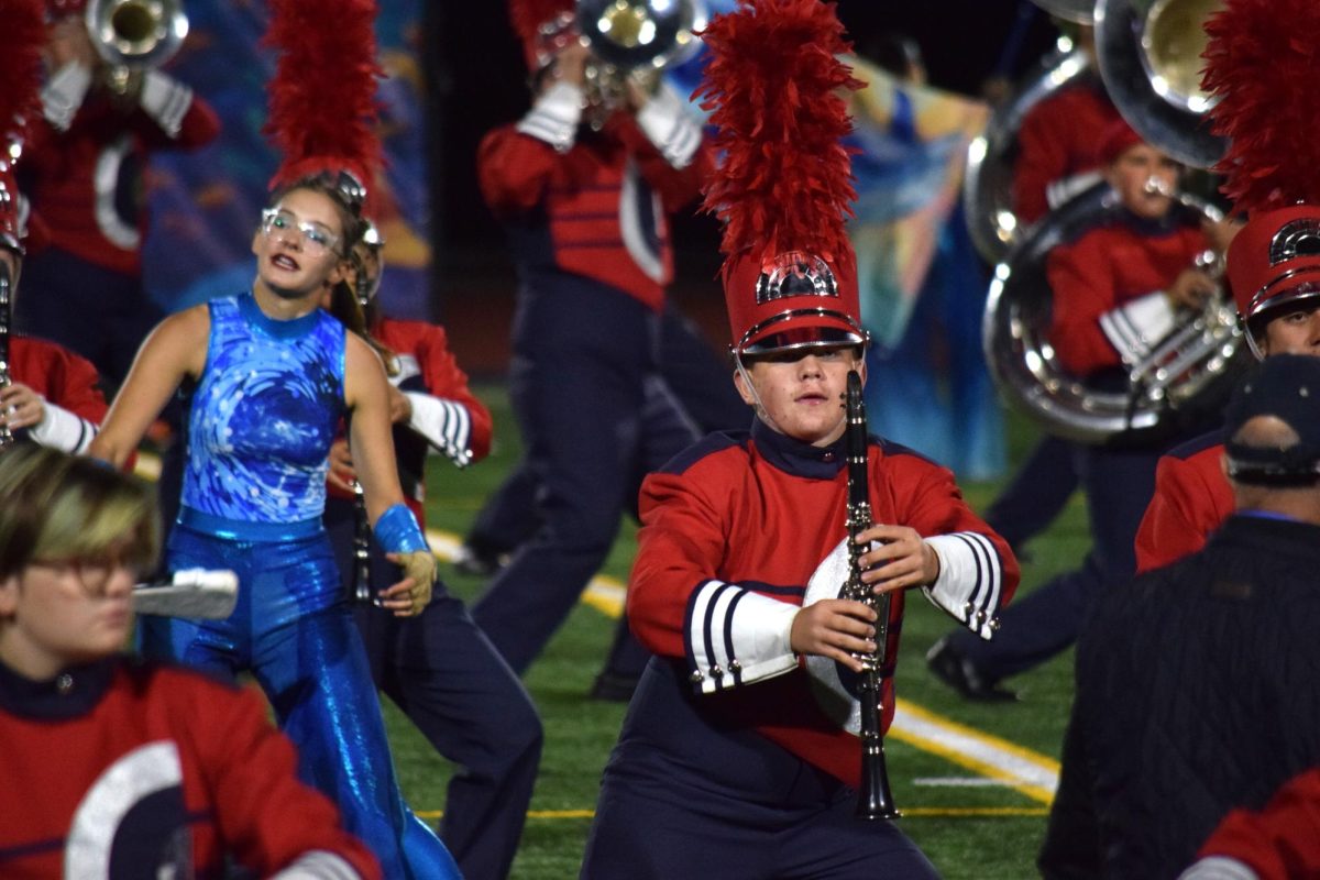 A member of the marching band competes during the 5A Regionals competition, in which the band placed first on Oct. 17. The team then went on to place 5th in the State Championship.