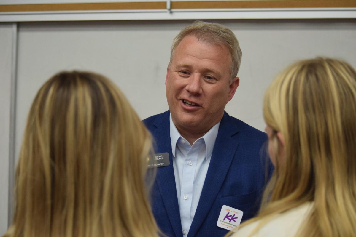 Senator Chris Kolker (D-16) speaks with students after the meeting. Multiple different Students Demand Action groups worked to host a panel-like meeting with Colorado state legislators in order to discuss gun violence and control.