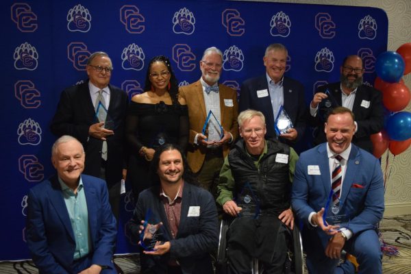 Nine out of ten inductees pose for a photo after the ceremony. The event honored Creek alumni and teachers who had achieved significant things in their field related to fine arts and science. 