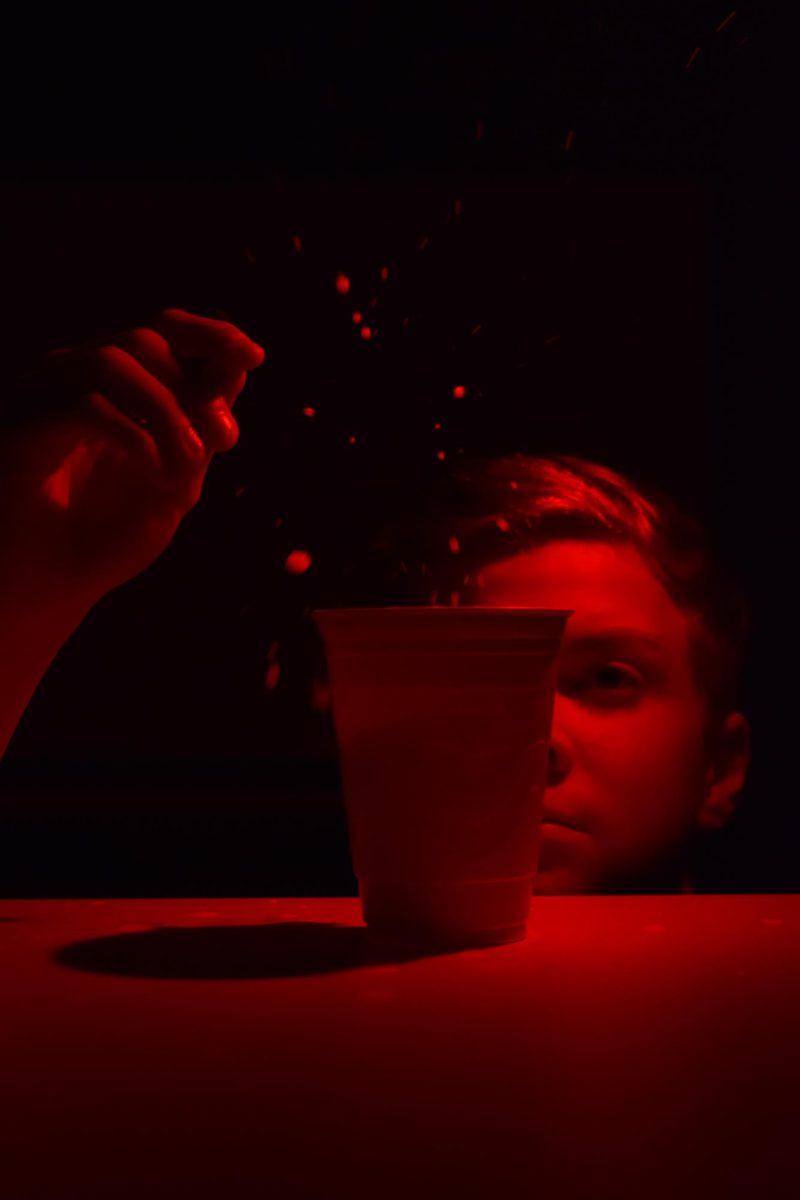 A member of the USJ staff poses for the cover, throwing a ping-pong ball into a red-solo cup. Often, students drink out of peer pressure, or as a coping mechanism, but the alcohol affects more than just themselves, it leads to a desire for a designated driver, or worse mental health, and sometimes administrative consequences. 