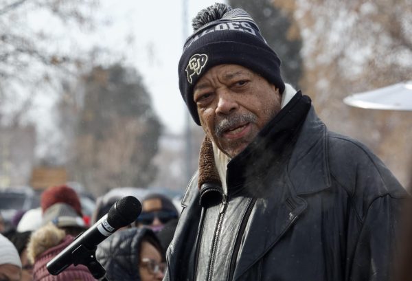 Former Denver Mayor Wellington Webb, the city’s first Black mayor, addresses community leaders surrounding him during his speech at the Martin Luther King Day Marade. His breath is frosty in the frozen air, which marchers trudged through on the cold morning. “I'm really glad people came out despite the cold weather this morning, I feel like the people coming together, we brought out the sunshine,” marcher Naomi Amaha said.