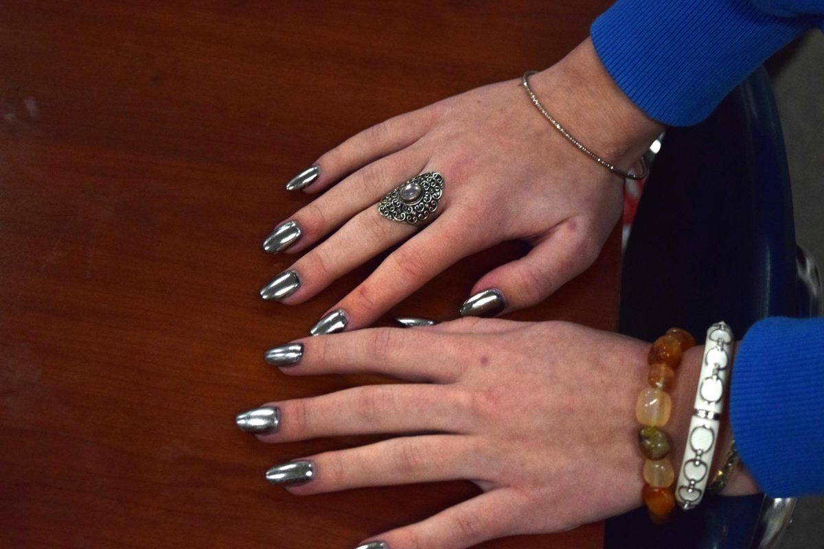 Junior Bella Fitzgerald displays shiny silver nails.