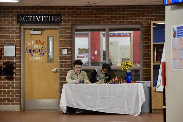 Senior Slavic Club President Viacheslav Riashchentcev (right) and senior member Benji Simberg man the club’s fundraising stand during fifth period on Feb. 3. They sell homemade crafts to contribute funds to Sunflower Seeds Ukraine, an organization working to provide humanitarian and tactical gear to Ukrainians.