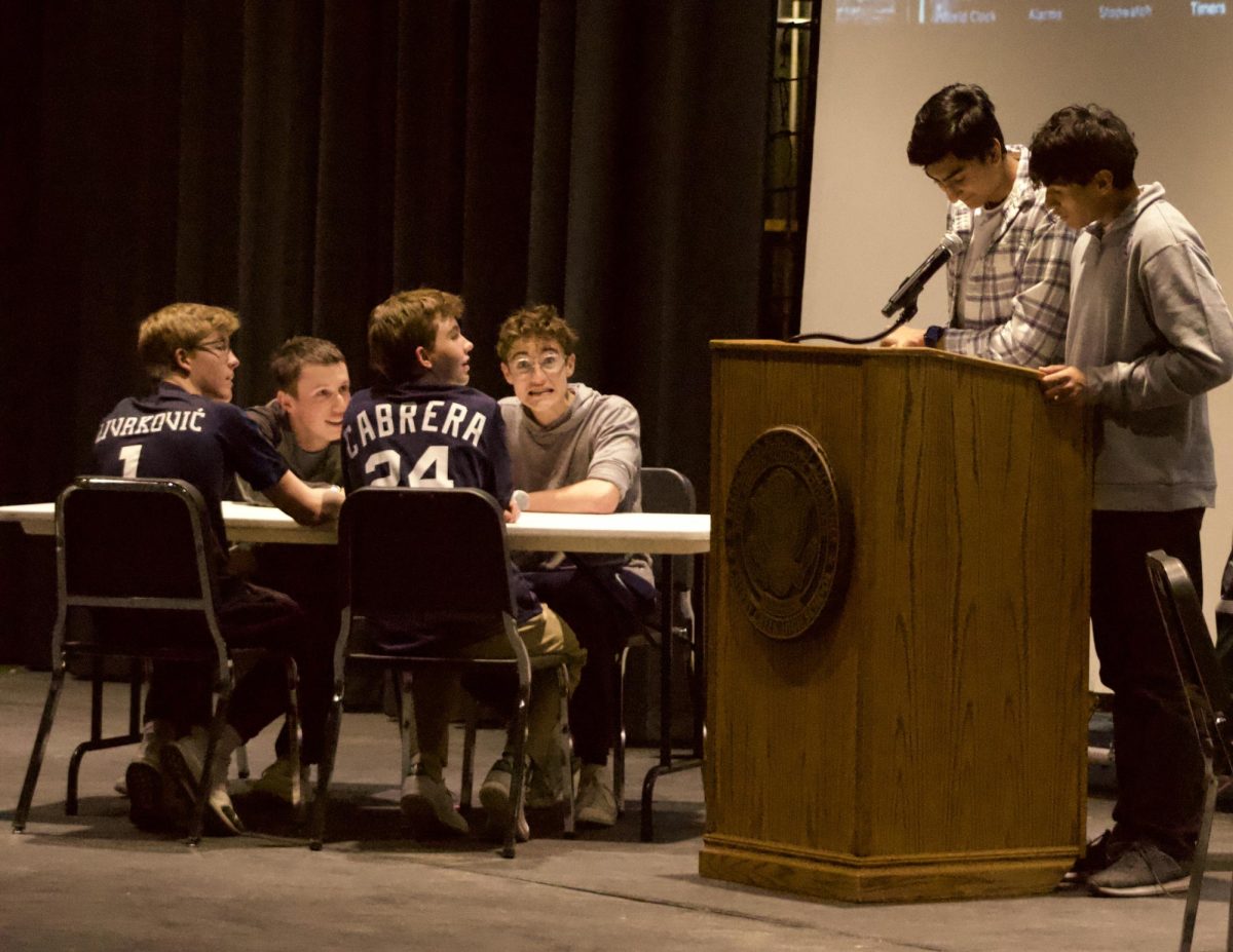 A team looks on in confusion as a question is read out at the Brain Bowl showdown.