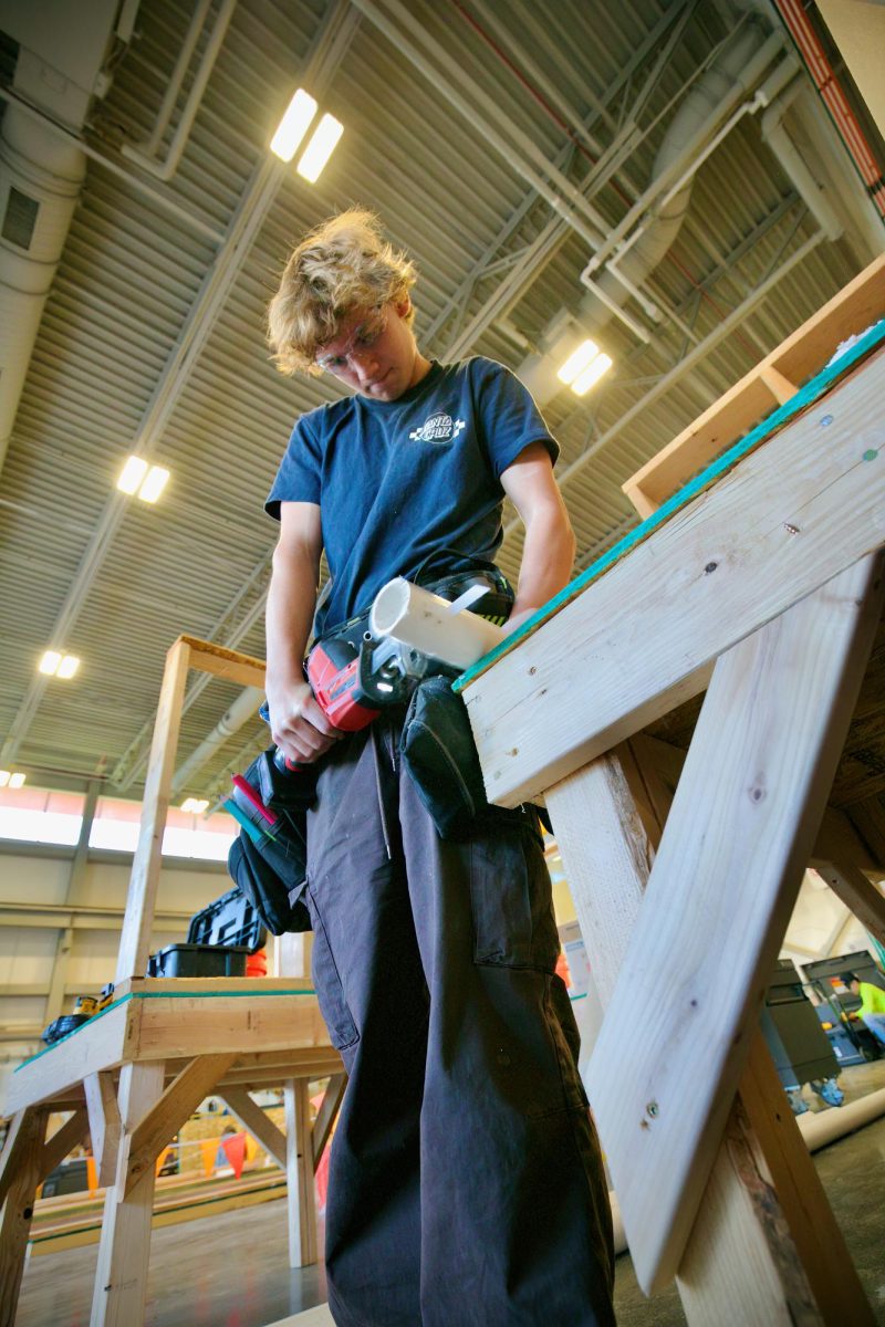 Creek junior Chris Tautz learns how to use a reciprocating saw on a piece of PVC pipe in CCIC’s Construction 1 class on Feb. 7. Tautz and other students in the class learn how to operate tools, and participate in building a house for Habitat For Humanity. For many students, opportunities like these allow them to develop career experience, and even earn certifications for future jobs. 