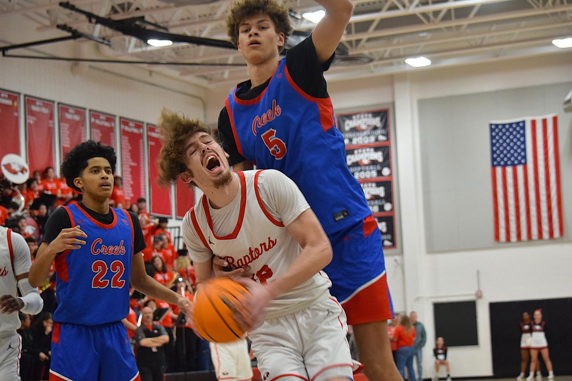 Freshman center Dylan Betts plays defense in a game against Eaglecrest. Creek lost the game 55-48.