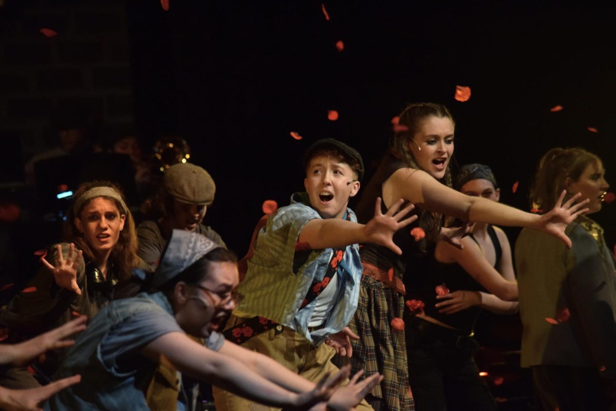 Seniors Elliot Moxcey, who played Orpheus, and Brooke Sax, who played Eurydice, sing as roses fall from the ceiling. “Hadestown” played from March 5 to 8, exploring the popular Greek myth of Orpheus and Eurydice for Creek students.