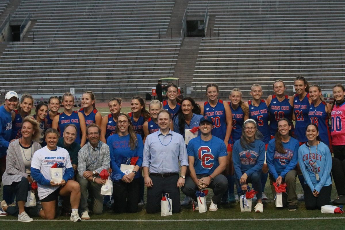Teachers and field hockey players gather for a photo shoot during the 2025 Teacher Appreciation Field 
Hockey Game.
