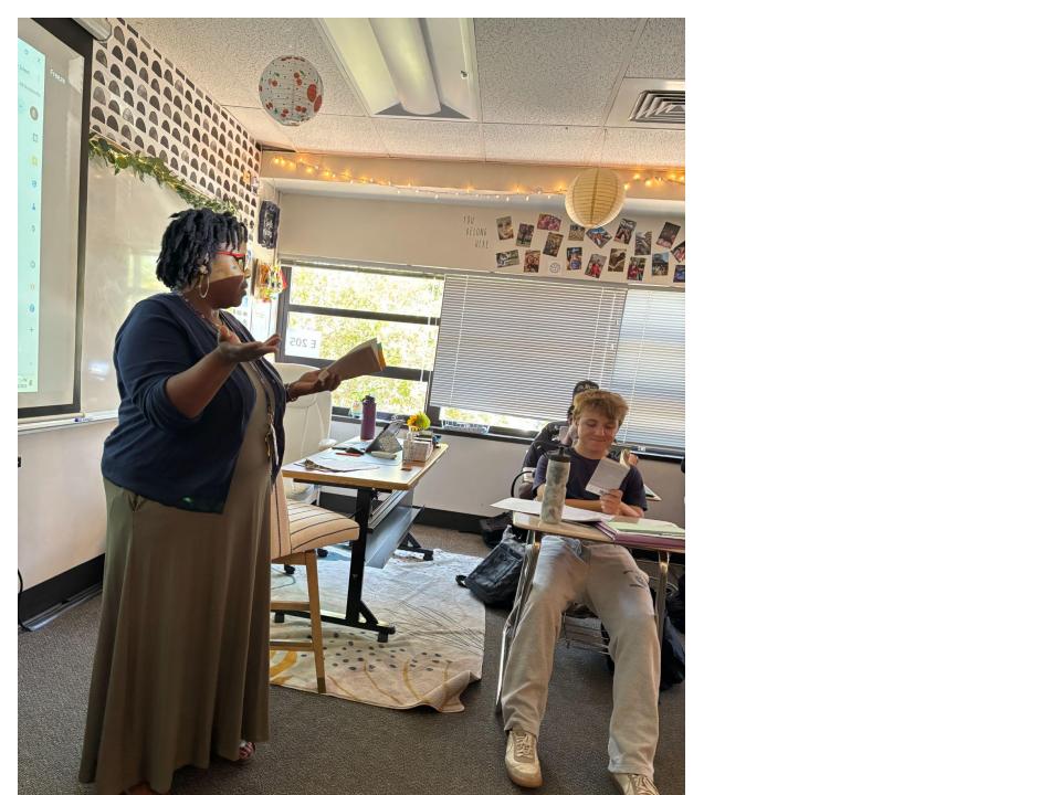 Ericka Deshay-Lowenkron lecturing, “Passing” by Nella Larsen, a book about two childhood friends navigating segregation in the 1920’s.