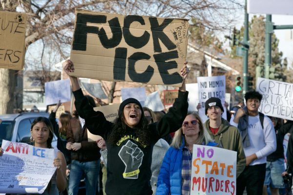 A marcher yells a chant, hoisting a “F--- ICE” sign. La Alma Lincoln Park became the center of Denver’s huge ICE protests on Jan. 29, as a rally and a march combined to speak out against ICE’s recent killings of citizens and mass deportations.