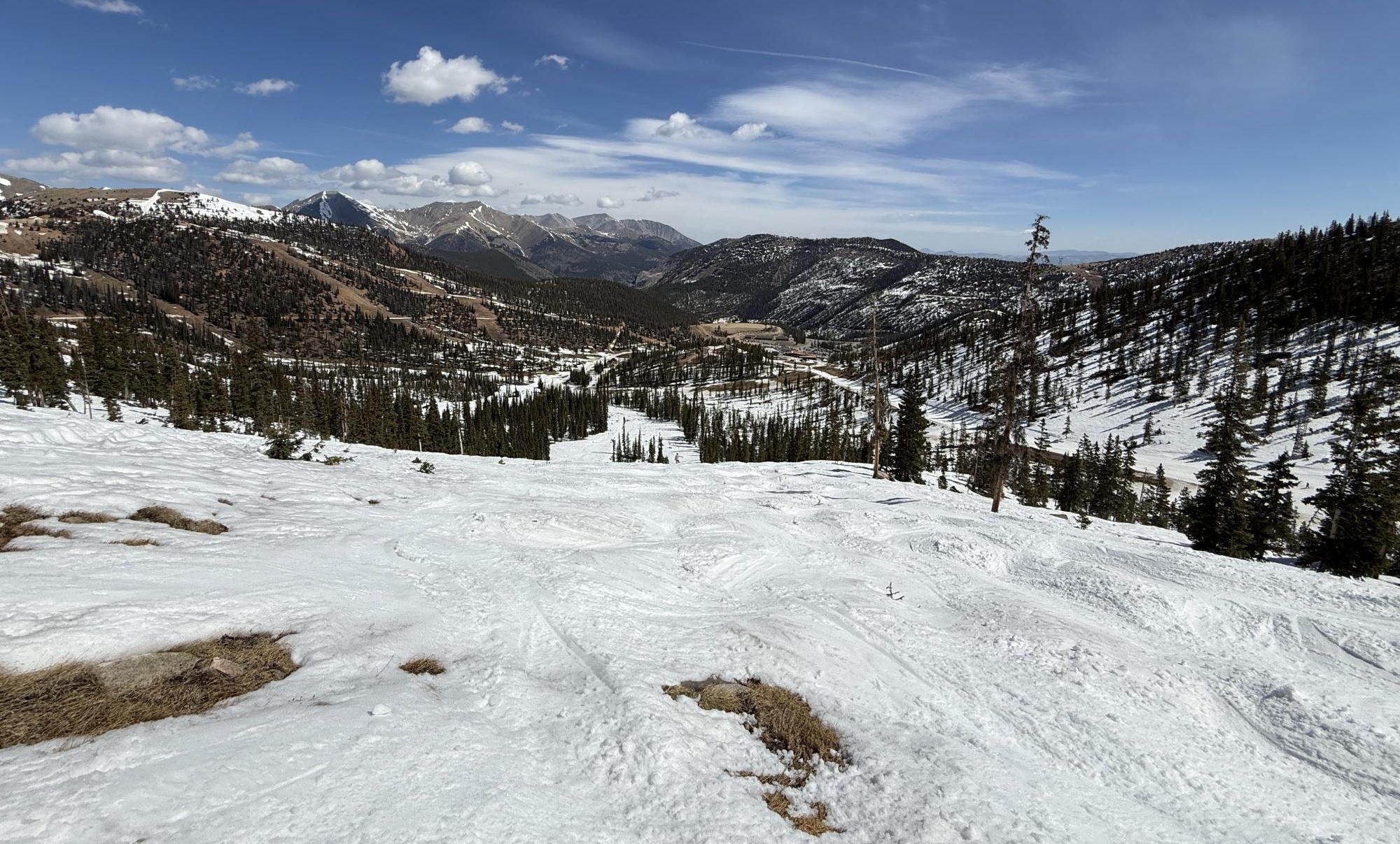 A view from the top of Monarch Mountain’s “Mirage” run, riddled with dirt patches, slush, and exposed stumps on March 29. Monarch closed two weeks earlier than last year, and like every Colorado mountain, experienced worse tourism, snowpack, and temperatures this ski season.