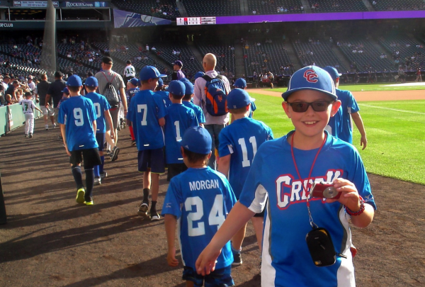 I walk the warning track at Coors Field on Arapahoe Youth League night in 2019, when the Rockies invited youth teams across the metro area to see the field up close before a game.